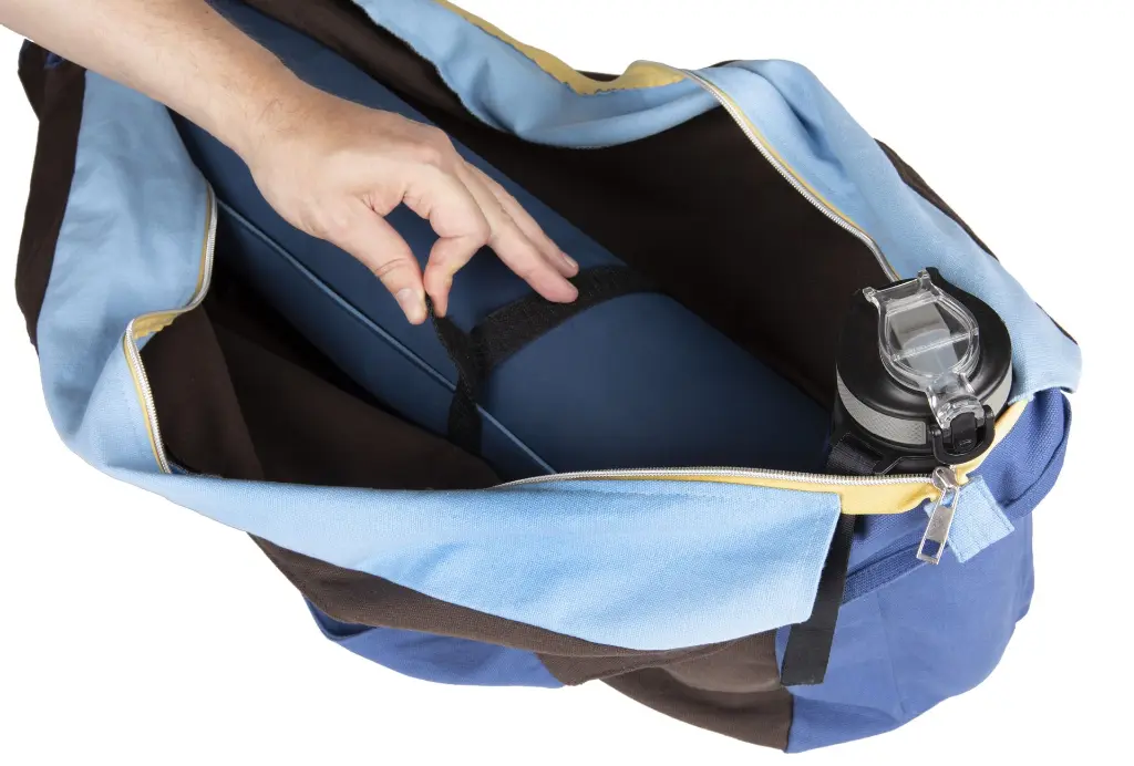 Extra Large brown Duffle bag with a water bottle holder inside and a sewn in Yoga Strap.webp