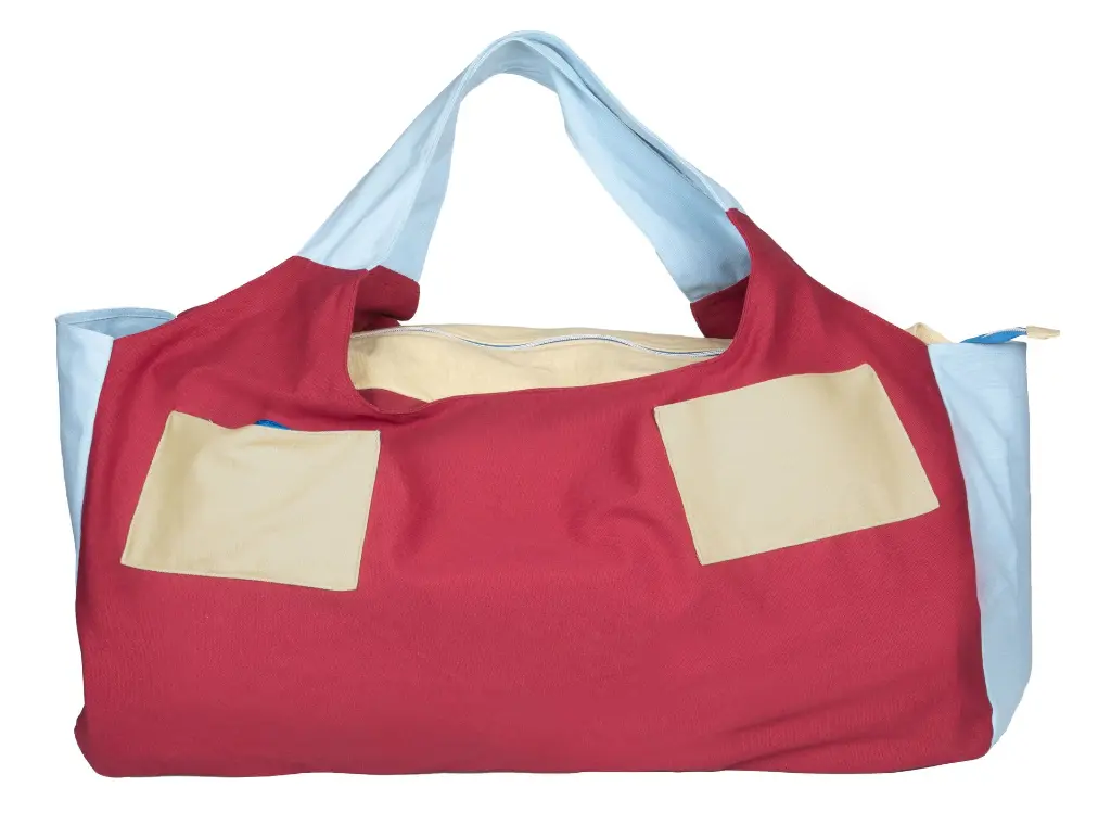 Back view of a red yoga mat bag with 2 zippers at the back and built in yoga straps.webp